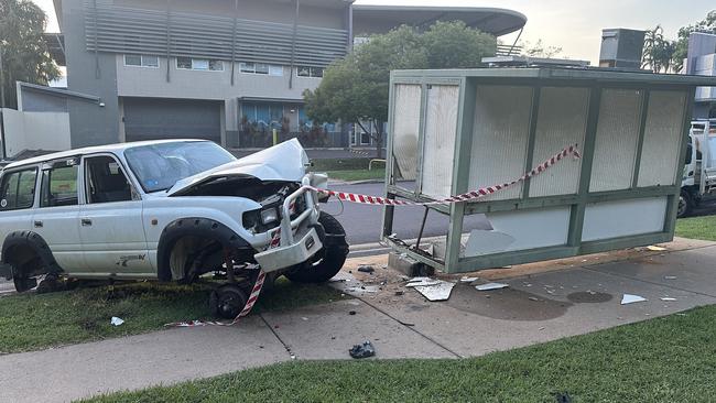 The wrecked LandCruiser and the badly damaged bus stop at Fannie Bay. Picture: Elise Graham