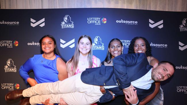 Eta Sikahele, Takoda Thompson, Savannah Roberts-Hickling, Phoenix-Raine Hippi with Aaron Booth at the Gold Coast Titans NRLW 2025 Season Launch at Isoletto The Star Gold Coast. Picture, Portia Large.
