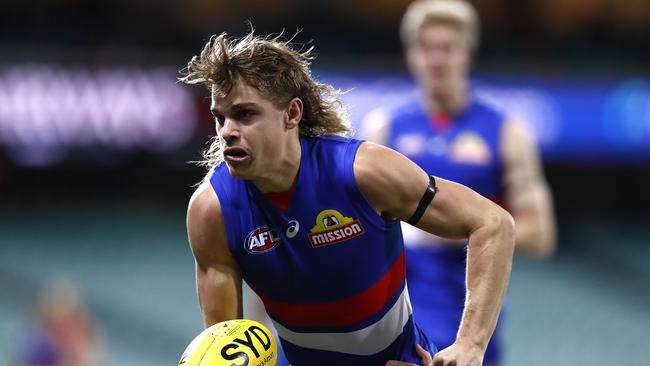 SYDNEY, AUSTRALIA – JUNE 25: Bailey Smith of the Bulldogs is tackled during the round 4 AFL match between the Sydney Swans and the Western Bulldogs at Sydney Cricket Ground on June 25, 2020 in Sydney, Australia. (Photo by Ryan Pierse/Getty Images)