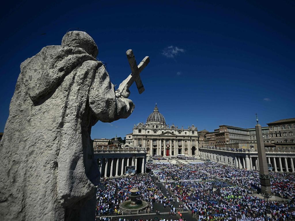 People gather as Pope Francis presides a mass on World Children's Day at St Peter's Basilica in the Vatican on May 26, 2024.