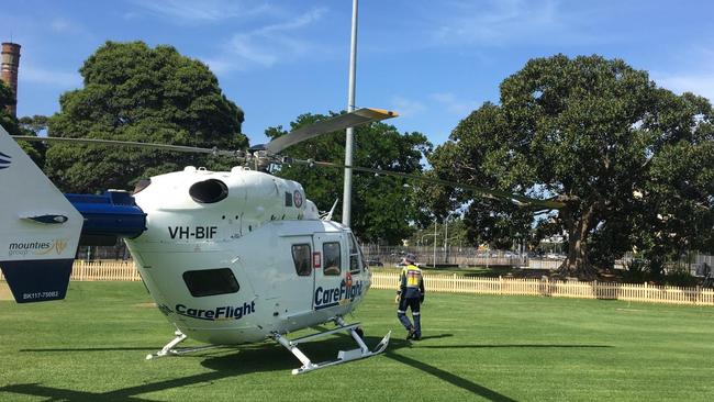 A CareFlight helicopter landed in St Leonard's Park, North Sydney, to treat a man seriously injured in a motorcycle incident on the Warringah Freeway. The man died in hospital two days later. Picture: CareFlight