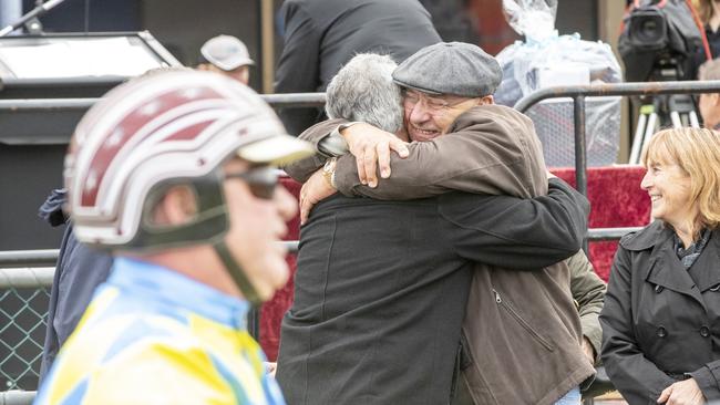 Anthony Butt (foreground) returns on Ultimate Strike after winning the Redwood Classic at Maryborough while owner Emilio Rosati celebrates in background. Picture: Stuart McCormick