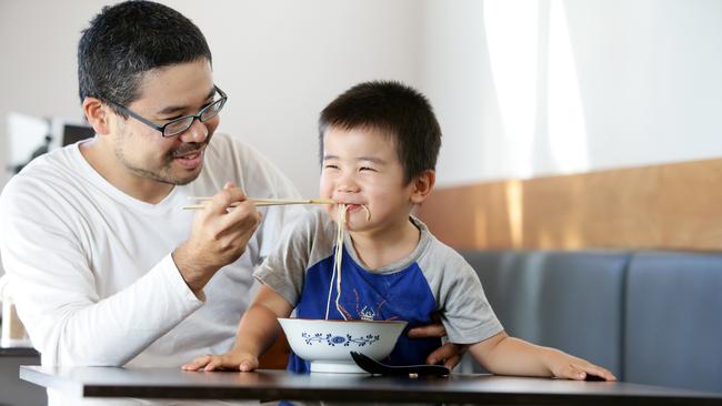 Taro Akimoto and son at their restaurant Taro's Ramen, South Brisbane. Picture: AAP/ Ric Frearson