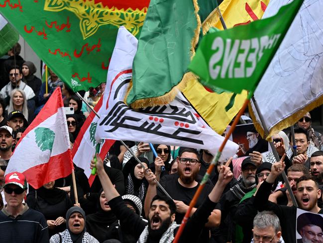 Demonstrators shout slogans against Israel as they gather to mourn the death of Hassan Nasrallah, late leader of the Lebanese group Hezbollah, at a protest rally in the central business district of Sydney on September 29, 2024. (Photo by Saeed KHAN / AFP)