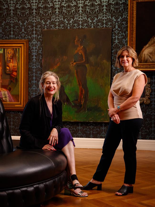 Art gallery director Rhana Devenport and Ramsay Foundation chief Kerry de Lorme standing in front of the Black Watchful painting. Picture: Matt Turner