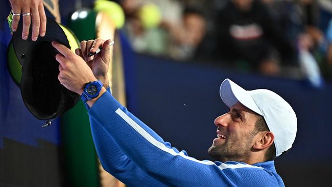 It’s been a long time since Novak Djokovic has needed a hat during a match at the Australian Open. (Photo by Lillian SUWANRUMPHA / AFP)