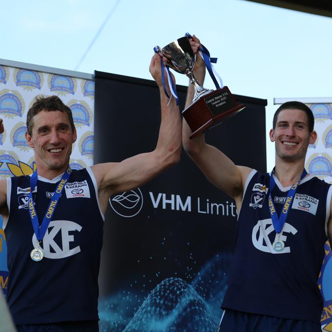 Kerang coach Troy Coates, left, and captain Josh Nitschke lift the Central Murray premiership cup. Picture: Tracy Roberts