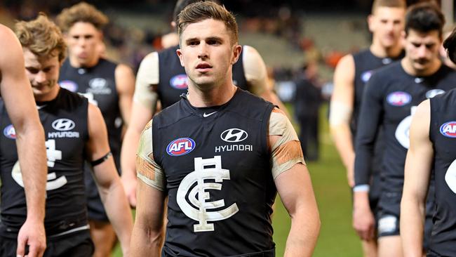 Marc Murphy leads Carlton players off the ground after another loss. Picture: AAP Images