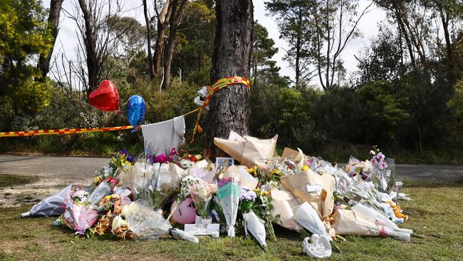 Flowers have been left at the crash site to commemorate the five teens who were killed. Picture: Richard Dobson