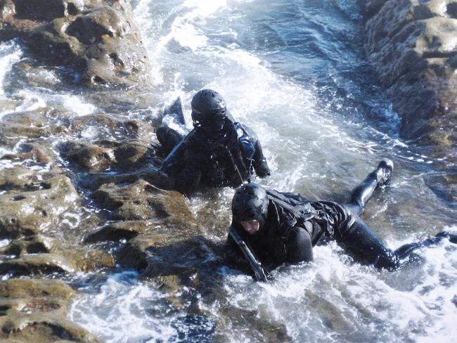 Fingers, front, takes part in a sniper water insertion course at Bear Island in Sydney. Picture: Sam Ruttyn/Supplied