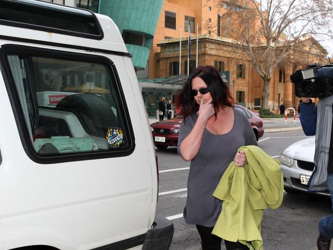 Hogben makes her way to a car. Picture: Stephen Laffer.