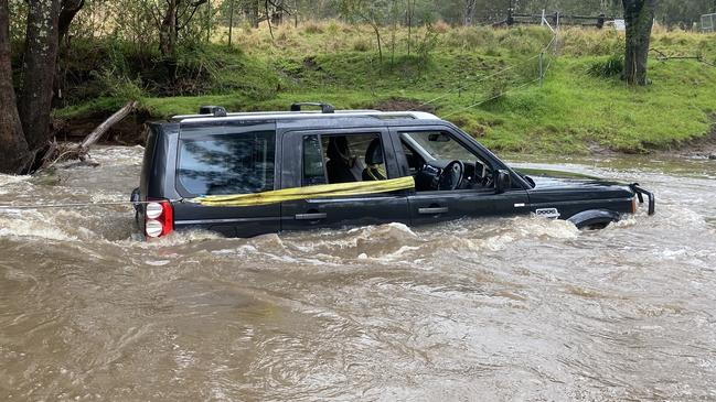 The stricken four-wheel drive had been washed off a flood caseway. Picture: NSW Police