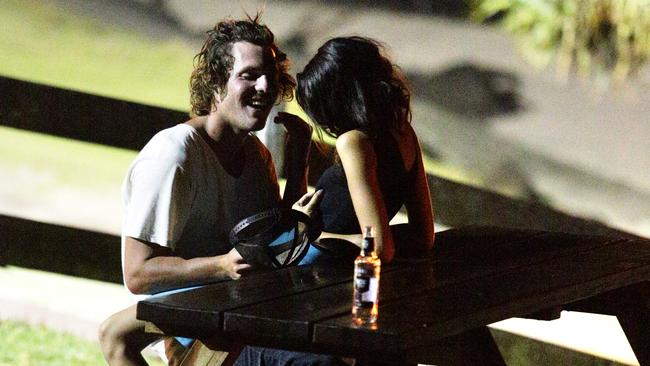 12:18am: A couple get intimate on a bench in Main Beach Park, Byron Bay. Saturday night at Schoolies, Byron Bay 2012. Drinking, alcohol, generic.