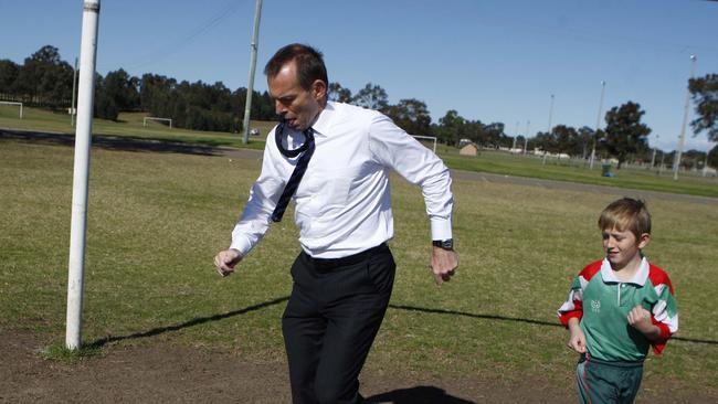 Opposition leader Tony Abbott and Daniel McNaught (8) have a kick around on soccer field at Jamison Park, Penrith while on campaign trail in Sydney's west for upcoming 2010 federal election.