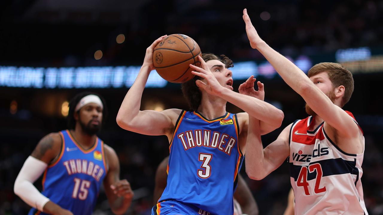 WASHINGTON, DC - JANUARY 11: Josh Giddey #3 of the Oklahoma City Thunder shoots in front of Davis Bertans #42 of the Washington Wizards during the first half at Capital One Arena on January 11, 2022 in Washington, DC. NOTE TO USER: User expressly acknowledges and agrees that, by downloading and or using this photograph, User is consenting to the terms and conditions of the Getty Images License Agreement. Patrick Smith/Getty Images/AFP == FOR NEWSPAPERS, INTERNET, TELCOS &amp; TELEVISION USE ONLY ==