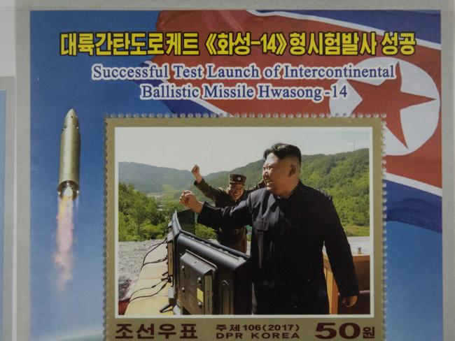 A commemorative stamp featuring an image of North Korean leader Kim Jong-un celebrates the launch of a Hwasong-14 ICBM. Picture: Ed Jones/AFP