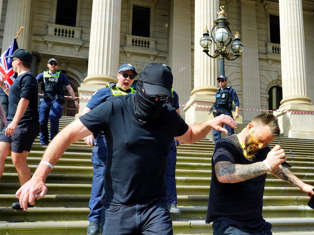 A man who had gathered with neo-Nazis took a face full of pepper-spray. Picture: NCA NewsWire / Luis Enrique Ascui