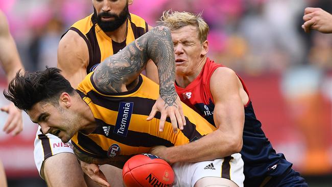 Chad Wingard of the Hawks is tackled by Josh Wagner of the Demons. Picture: Getty Images