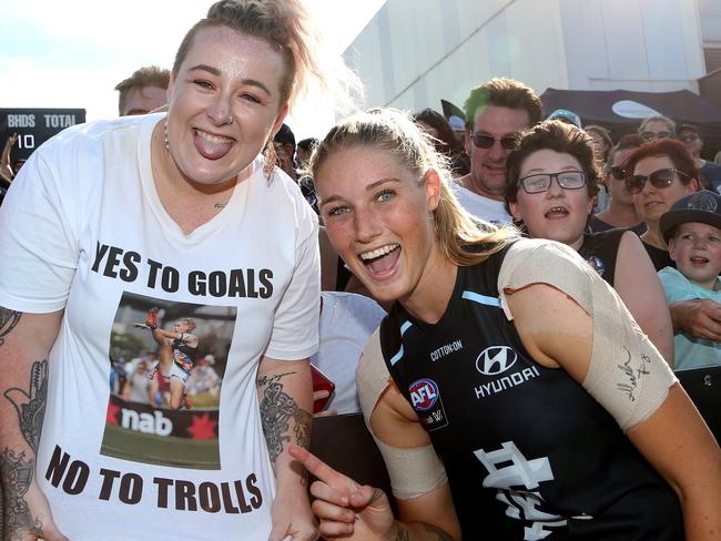 Tayla Harris of the Blues (right) celebrates with a fan after the AFLW Preliminary Final match between the Carlton Blues and the Fremantle Dockers at Ikon Park, Melbourne, Saturday, March 23, 2019. (AAP Image/Hamish Blair) NO ARCHIVING, EDITORIAL USE ONLY