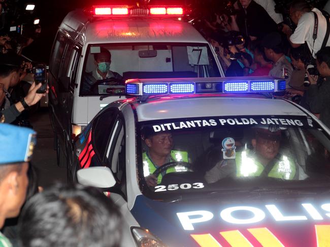 Ambulance transports one of the coffins of the executed prisoners back from Nusakambangan island.