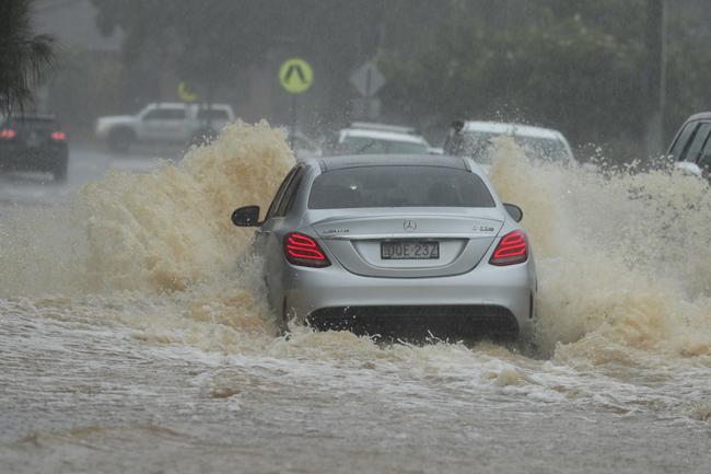 Cars continue to get stuck in flood waters as people try to drive through them .Picture: John Grainger