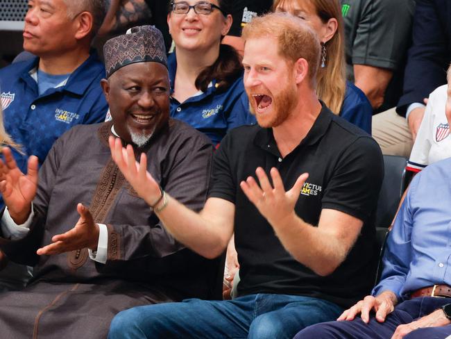 Britain's Prince Harry, Duke of Sussex (2R) reacts as he attends the Wheelchair Rugby Canada vs New Zealand match of the 2023 Invictus Games in Duesseldorf, western Germany on September 10, 2023. The Invictus Games, an international sports competition for wounded soldiers founded by British royal Prince Harry in 2014 run from September 9 to 16, 2023 in Duesseldorf. (Photo by Odd ANDERSEN / AFP)