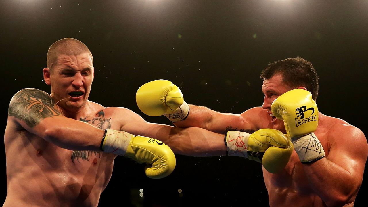 Paul Gallen throws a right at Randall Rayment. (Photo by Mark Metcalfe/Getty Images)