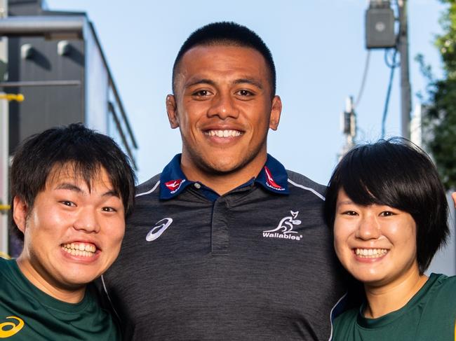 Qantas Wallabies appearance at ASICS Harajuku flagship store, Tokyo, ahead of the third Bledisloe Cup Test Match at Nissan Stadium, Yokohama. Allan Alaalatoa with Japanese Wallaby fans Moe Tsuchiya and Hirokazu Iwasaki. Photo: Stuart Walmsley/Rugby AU Media