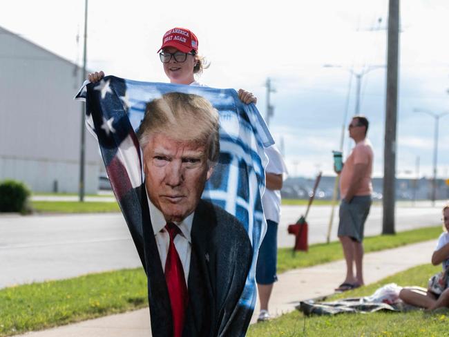 MILWAUKEE, WISCONSIN - JULY 14: Supporters of Republican presidential candidate, former U.S. President Donald await his arrival at Milwaukee Mitchell International Airport on May 10, 2024 in Milwaukee, Wisconsin. Law enforcement officials began final preparations on the eve of the Republican National Convention where Trump is expected to formally receive the GOP nomination for the 2024 U.S. Presidential election. Trump suffered minor injuries during a campaign rally on on July 13 in Butler, Pennsylvania after a gunman opened fired, killing one person and injuring two critically.   Jim Vondruska/Getty Images/AFP (Photo by Jim Vondruska / GETTY IMAGES NORTH AMERICA / Getty Images via AFP)