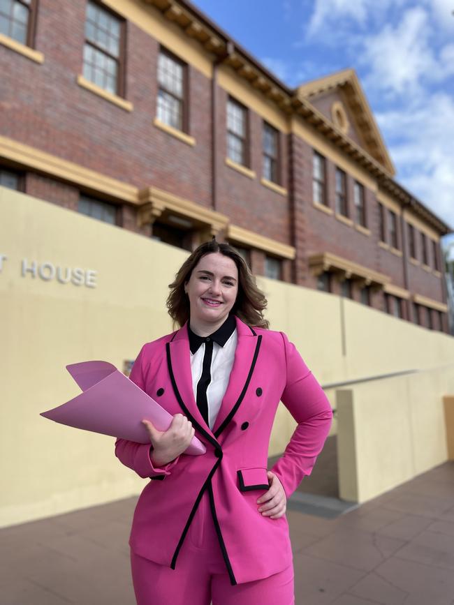 Solicitor Laura Santin in her pink suit outside Mackay Courthouse. Photo: Zoe Devenport