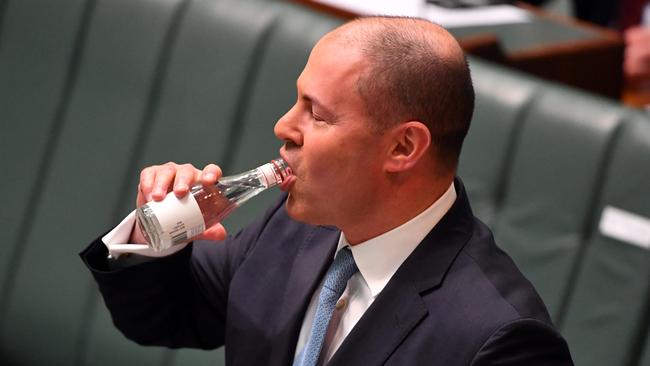 Treasurer Josh Frydenberg drinks water after a coughing fit as he makes a ministerial statement to the House of Representatives at Parliament House in Canberra, Tuesday, May 12, 2020. Picture: AAP