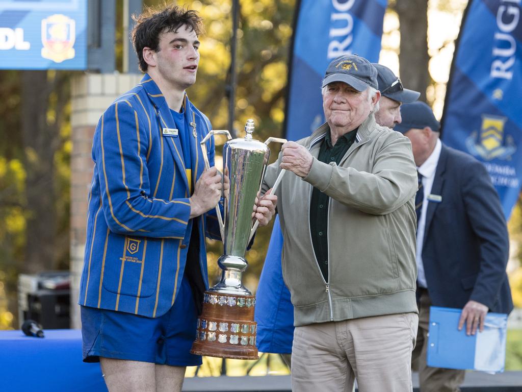 TGS 1st XV captain George Griffiths accepts O'Callaghan Cup from Patric O'Callaghan.