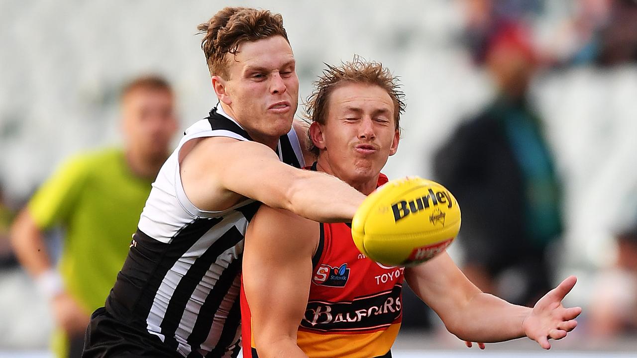 Jack Strange, of Port Adelaide, spoils Jake Cook, of the Crows. Picture: Mark Brake/Getty Images