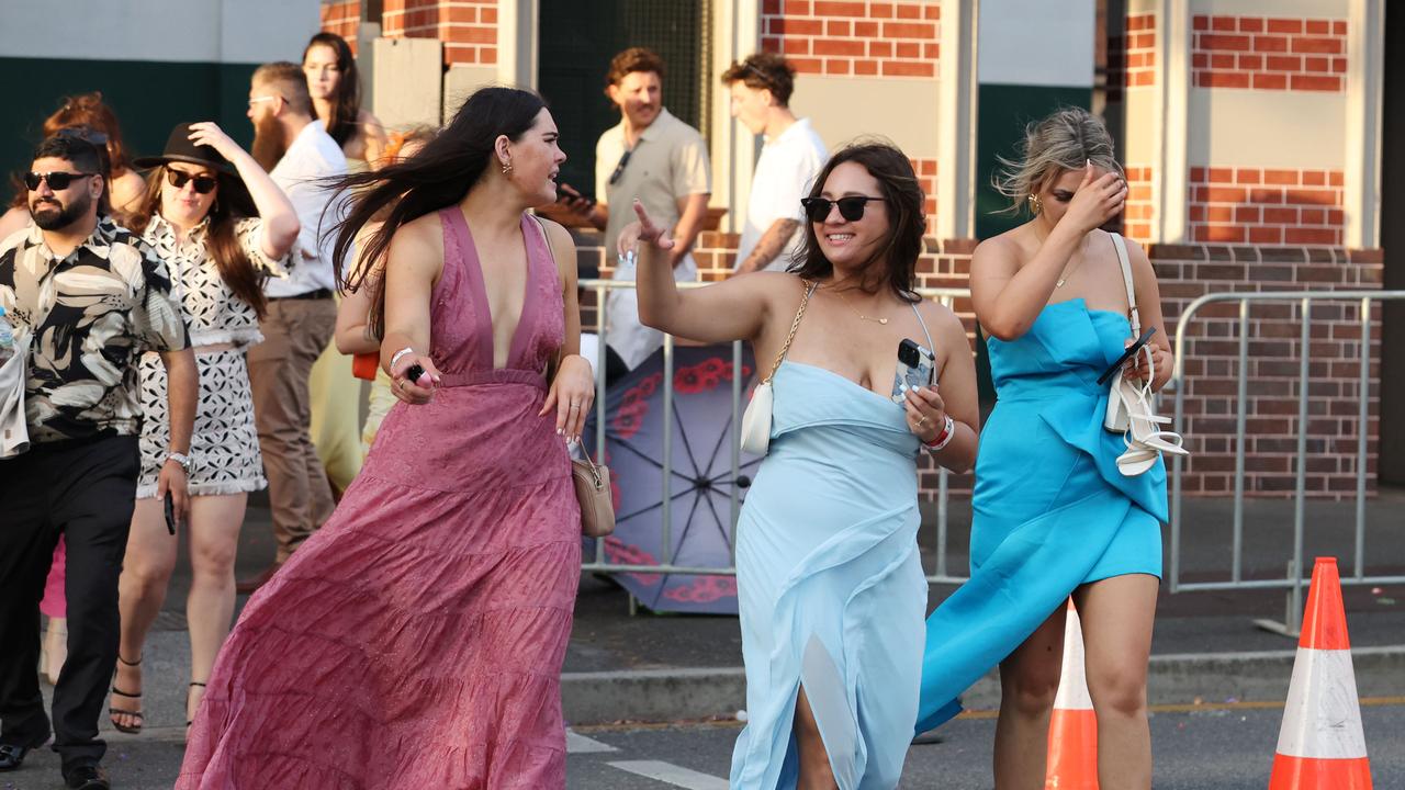 Punters leave Eagle Farm racecourse on Melbourne Cup Day.