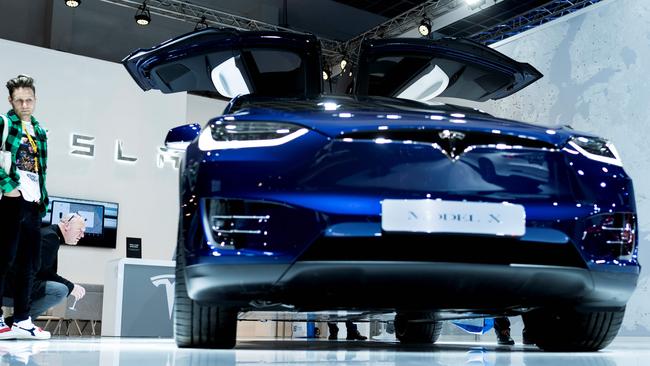 A Tesla Model X car is displayed during a press day at the Brussels Motor Show on January 9, 2020 in Brussels. (Photo by Kenzo TRIBOUILLARD / AFP)