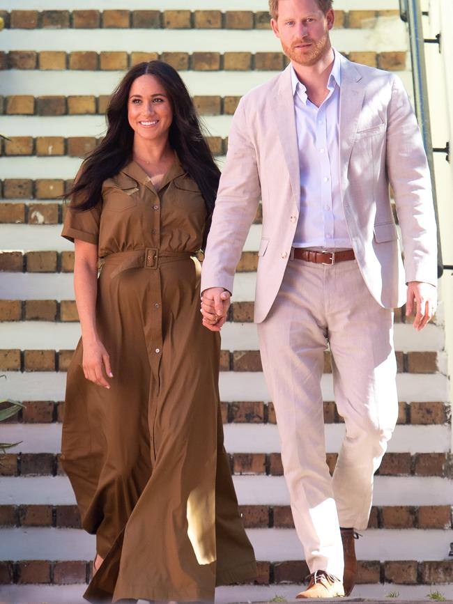 Meghan, Duchess of Sussex found the perfect fashion solution to travel, and post-partum comfort: the humble shirt dress. Picture: Pool/Samir Hussein/WireImage