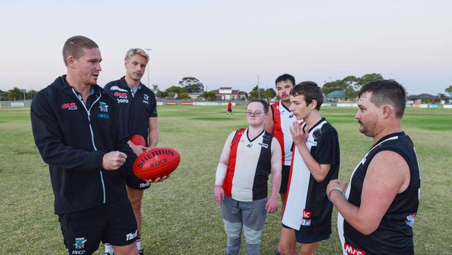 Power players Tom Clurey and Billy Frampton give the Saints players a few pointers. Picture: Brenton Edwards