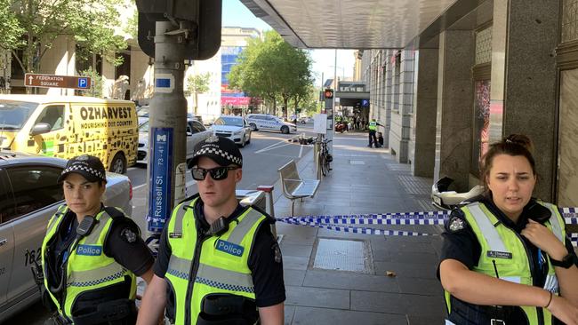 Police have taped off the busy intersection to pedestrians. Picture: Josh Fagan