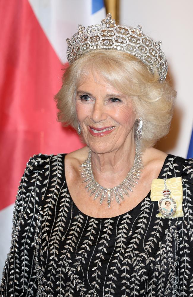 Camilla, Queen Consort wears the late Queen’s diamond necklace, the honeycomb Boucheron diamond tiara and the historic Queen’s Order pinned to her gown. Picture: Getty Images