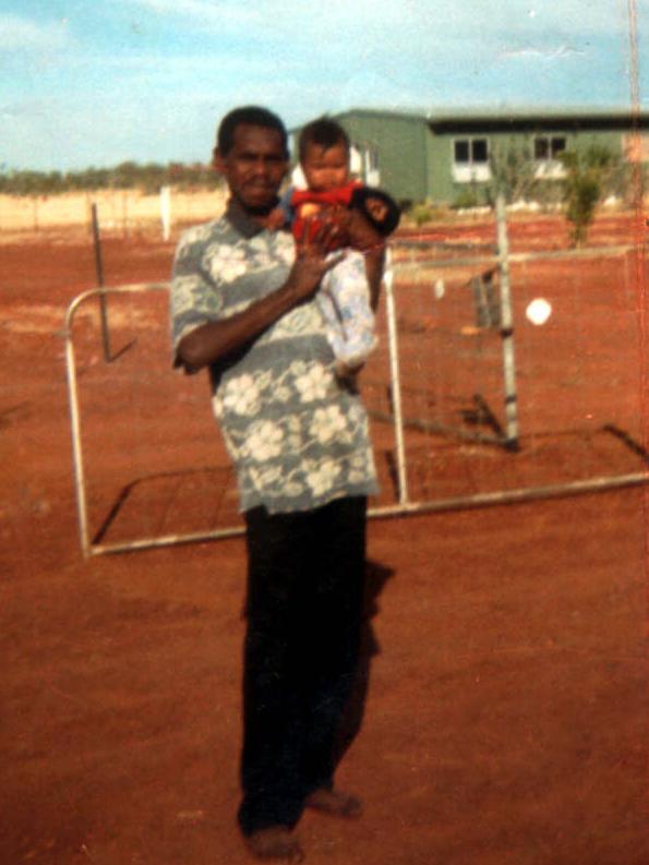 Christopher Limerick, pictured holding his niece, died in mysterious circumstances. Picture: Supplied