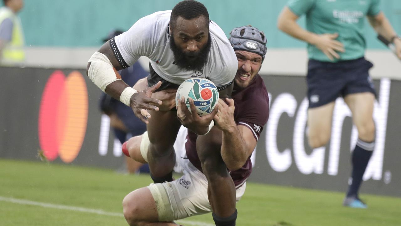 Fiji’s Semi Radradra dives in the tackle of Georgia’s Beka Gorgadze to score a try.