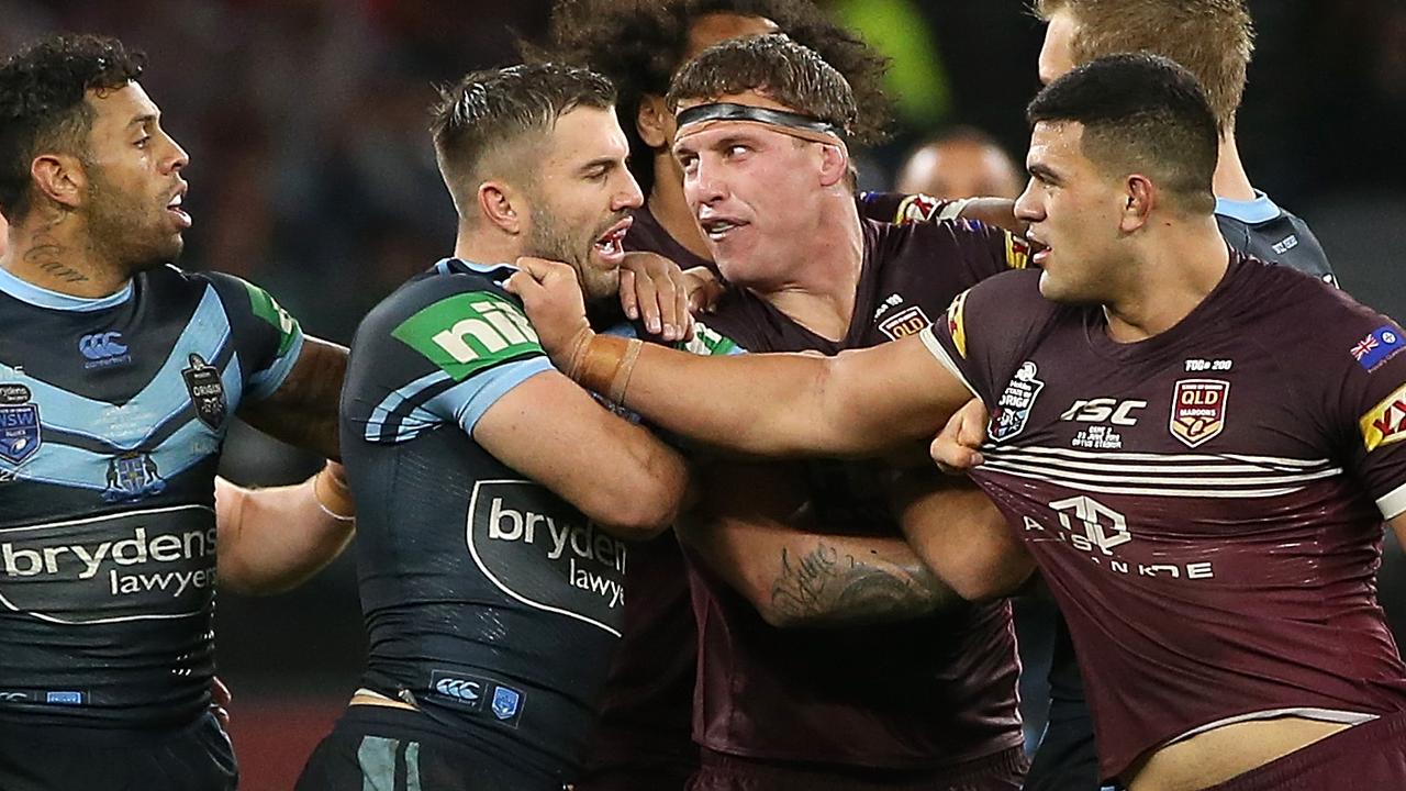 James Tedesco of NSW remonstrates with David Fifita and Jarrod Wallace of Queensland during game two.