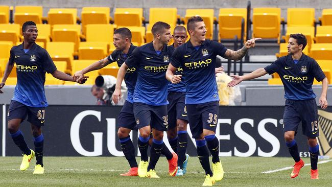 Stevan Jovetic of Manchester City celebrates his first half goal against AC Milan.