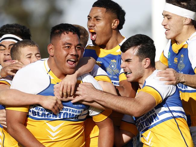 Tevita Alatini celebrating his try with Patrician Brothers Blacktown teammates during the NRL Schoolboy Cup grand final re-match between Westfields SHS and Patrician Brothers Blacktown at Aubrey Keech Reserve, Hinchinbrook. Picture: Jonathan Ng