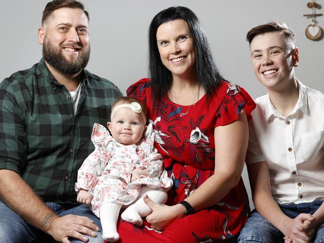 NSW NETWORK JUNE 1, 2022. Deborah Hughes with her 6-month-old daughter Ruby, husband Brendan and son Marcus,13, at home in Spring Farm. The couple had five failed IVF attempts before switching to Genea and having baby Ruby after just one cycle. Picture: Jonathan Ng