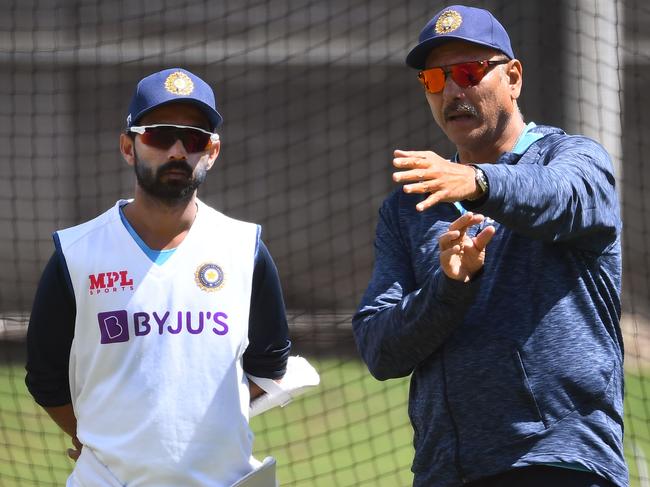 India’s stand-in Test captain Ajinkya Rahane (left) chats with coach Ravi Shastri during a net session ahead of today’s Boxing Day Test. Picture: AFP