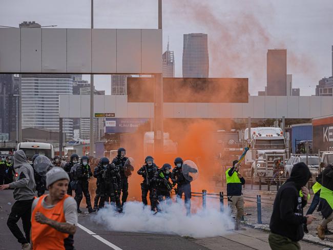 Police tackle protesters on the West Gate Bridge. Picture: Jason Edwards