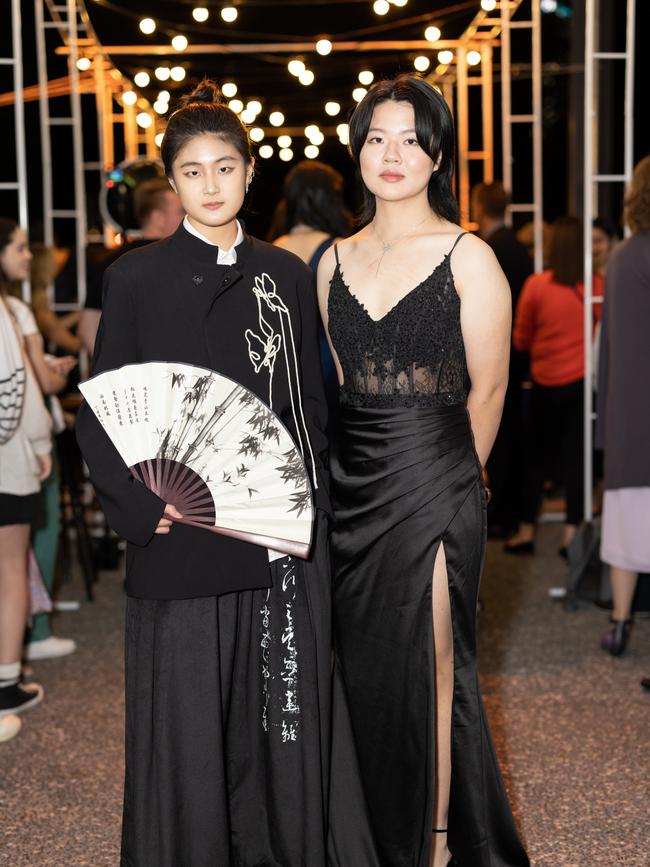 Gloria Zhou and Miranda Wang at the year 12 St Hilda formal. Photo: Celeste Humphrey