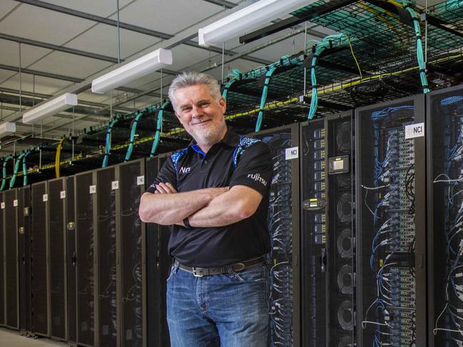 Australian National University Associate Professor Megan O'Mara (front) and Professor Sean Smith, Director of the National Computational Infrastructure, with ANU supercomputer 'Gadi'. Megan uses Gadi for research on COVID-19. Gadi is currently one of the fastest supercomputers in the world. Picture by Sean Davey.