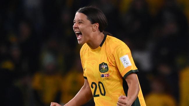 Australia's forward #20 Sam Kerr celebrates at the end of the Australia and New Zealand 2023 Women's World Cup round of 16 football match between Australia and Denmark at Stadium Australia in Sydney on August 7, 2023. (Photo by FRANCK FIFE / AFP)